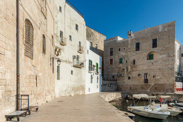 Fototapeta na wymiar Strolling along the streets of Monopoli. Boats and places of magic
