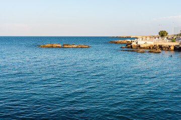 Fototapeta premium Strolling along the streets of Monopoli. Boats and places of magic