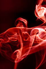 Red smoke motion on black background.