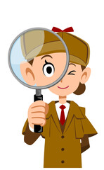 虫眼鏡をのぞく女性の探偵の上半身
