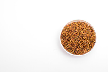Pile of buckwheat isolated on white background. Top view. Buckwheat. Buckwheat grains. Grain culture.