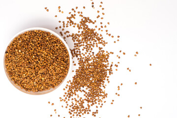 Pile of buckwheat isolated on white background. Top view. Buckwheat. Buckwheat grains. Grain culture.