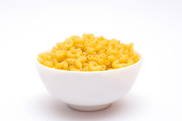 Raw italian pasta in bowl isolated on white