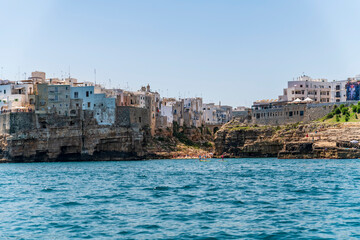 Polignano a Mare seen from the sea. Cliffs and caves