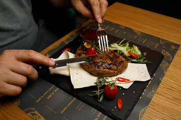 steak on the board, restaurant meat hand