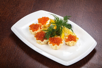 Red caviar canape served dill