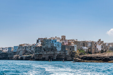 Polignano a Mare seen from the sea. Cliffs and caves