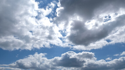 Beautiful blue sky with clouds background. Sky clouds. Air and fluffy clouds in the blue sky on a sunny day, background texture. Copy space. The concept of hope.