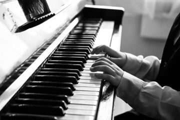 Portrait of kid playing piano, Young boy learning music with an piano in musical scholl. Child...