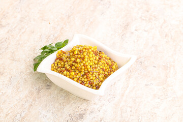 Grain mustard sauce in the bowl