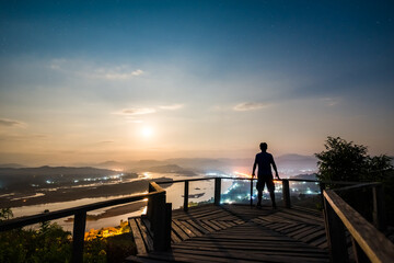 Fototapeta premium landscape of Mekong River in Night sky with the man on wooden bridge