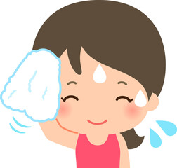 タオルで汗を拭く笑顔の女性