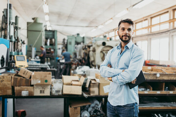 Fototapeta premium Middle age businessman doing quality control checking at industry production. Factory for industrial production of electric housings and surge arresters.