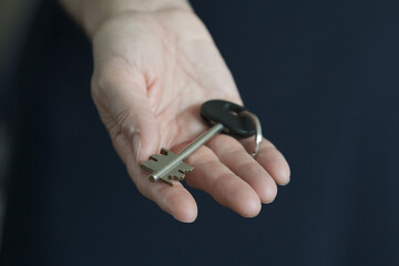 House key in hand.
