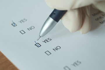 The questionnaire sheet with the answer yes.