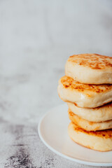Cottage cheese cheesecakes on a wooden board