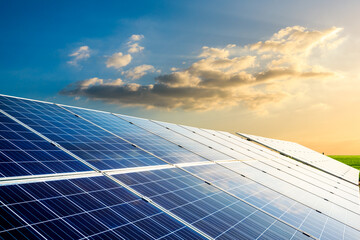 Solar power panels and beautiful natural landscape at sunset in summer in China © zhao dongfang