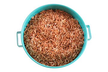 Germinated Sangyod brown GI Muang Phatthalung rice in the blue bowl isolated on white background. Healthy food.Top view. Flat lay. 