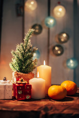 Christmas decor with candles and gifts