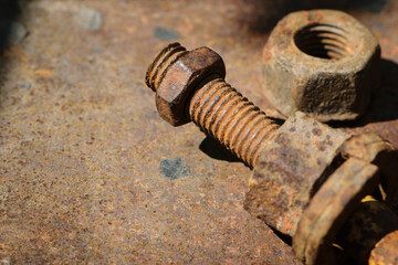 rusty nut. Rusty iron rod with screw threads. Rusted mechanical components. threaded bolt and nut isolated close up. dismantling concept, difficult to unscrew, non-removable. space for text