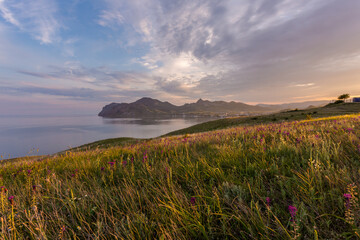 A beautiful village on the Black Sea coast of Koktebel. Unforgettable sunrises and sunsets in summer in the Crimea.