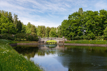 Fototapeta na wymiar The old bridge in the Public Park in Pavlovsk