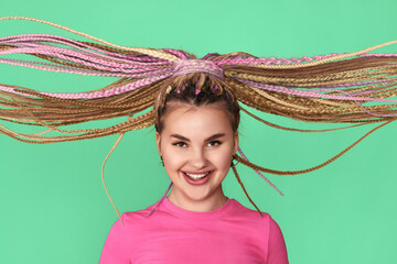 happy woman with flying dreadlocks is smiling