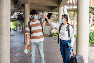 Travel, man and woman act team pose during trip. stand and look at each other. carry luggage and backpacks.stripped shirt and eyeglasses