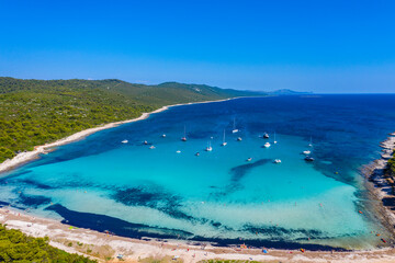 Amazing Adriatic sea in Croatia. Aerial view of azure turquoise lagoon on Sakarun beach on Dugi Otok island, yachts anchored blue sea, tourist paradise.