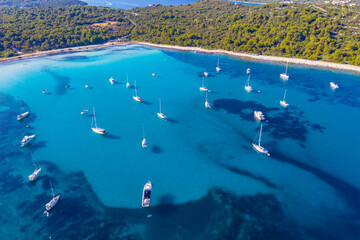 Aerial view of sailing boats in a beautiful azure turquoise lagoon on Sakarun beach bay on Dugi Otok island, Croatia, beautiful seascape