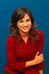 Obraz premium Indian young girl in pink dress with blue background
