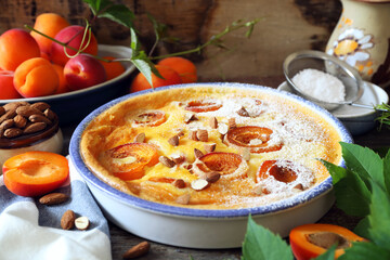 Apricot clafoutis (flan) with almonds, icing sugar dressing
