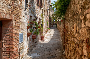 Colle dColle di Val d'Elsa, Tuscany, Italy. August 2020. Photo in an alley in the historic center: enchanting glimpses of medieval times full of charm.