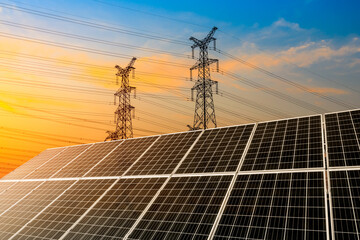 Solar power panels and high voltage power tower background landscape in China