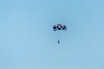 Paragliding in the blue sky