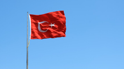 Turkish flag on cloudy sky background