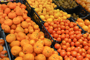 Fresh oranges on the market placed in boxes, healthy food