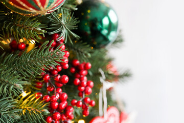 Obraz na płótnie Canvas Christmas background - baubles and branch of spruce tree