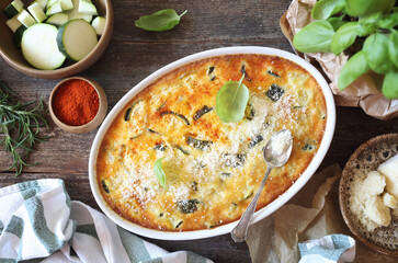 French cuisine. Zucchini clafoutis with Parmesan  cheese in ceramic bakeware