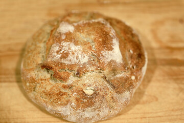 Homemade sourdough bread in a conventional oven. - 449174907