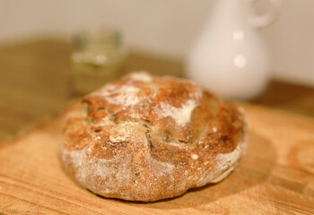 Homemade sourdough bread in a conventional oven. - 449174984