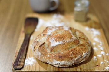 Homemade sourdough bread in a conventional oven. - 449175311