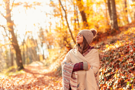 Woman relaxing in nature on a sunny autumn day