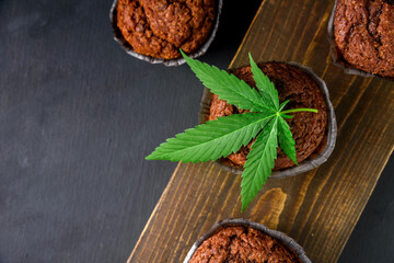 Chocolate muffin or cake with cannabis leaf, cbd infused