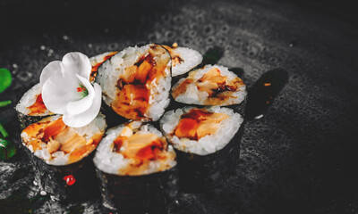 sushi roll in plate on wooden table background