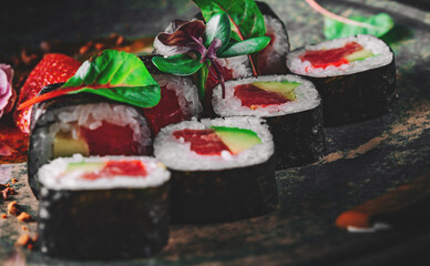 sushi roll in plate on wooden table background