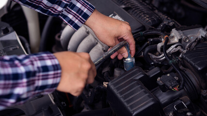 Young man practicing broken car on the side of the road, long-distance driving concept.