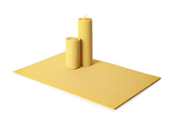Handmade wax candles on white background