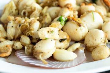 Grilled scallop cook with garlic background