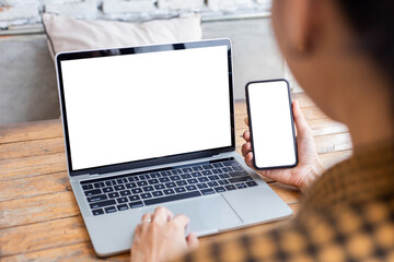 computer screen,cell phone blank mockup.hand woman work using laptop texting mobile.white background for advertising,contact business search information on desk in cafe.marketing,design